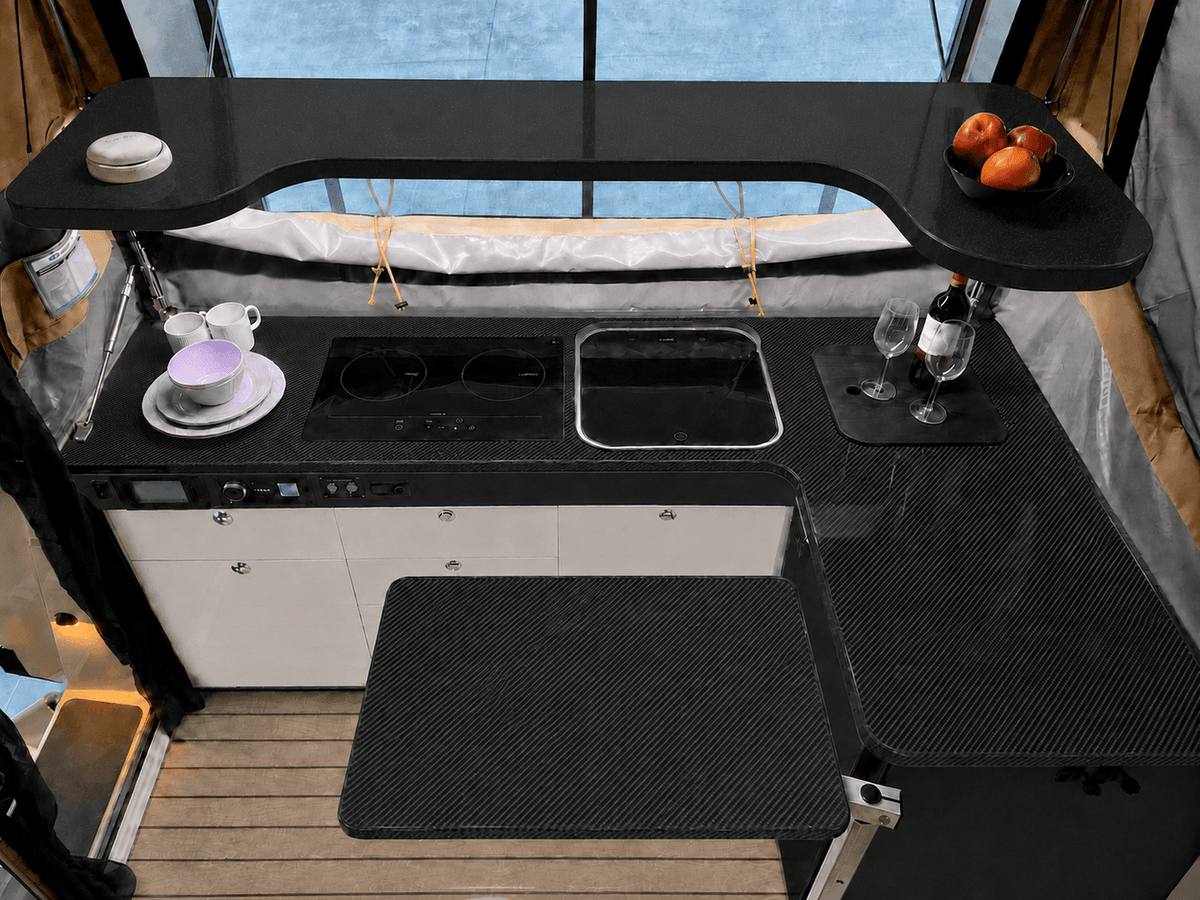 Carbon bench, table and galley shelf with charcoal fascia